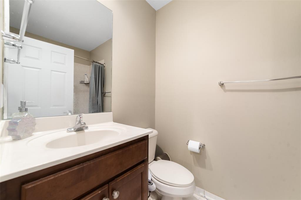 8915 Southwest 19th Street, Unit 8915 Miramar, FL 33025 - Photo 16 of 27 a bathroom with a sink toilet and a mirror