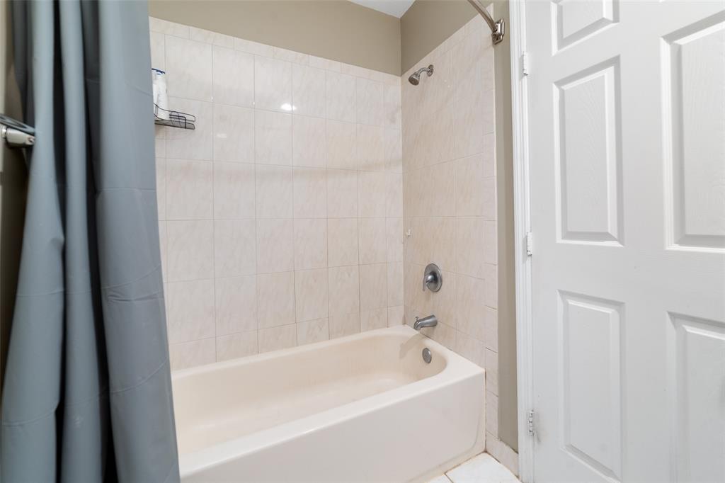 8915 Southwest 19th Street, Unit 8915 Miramar, FL 33025 - Photo 17 of 27 a bathroom with a bathtub and shower