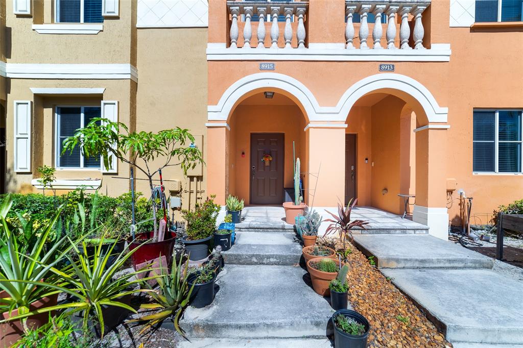 8915 Southwest 19th Street, Unit 8915 Miramar, FL 33025 - Photo 2 of 27 a view of entryway with garden
