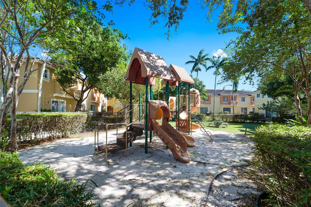 8915 Southwest 19th Street, Unit 8915 Miramar, FL 33025 - Photo 22 of 27 a view of a house with backyard and a tree
