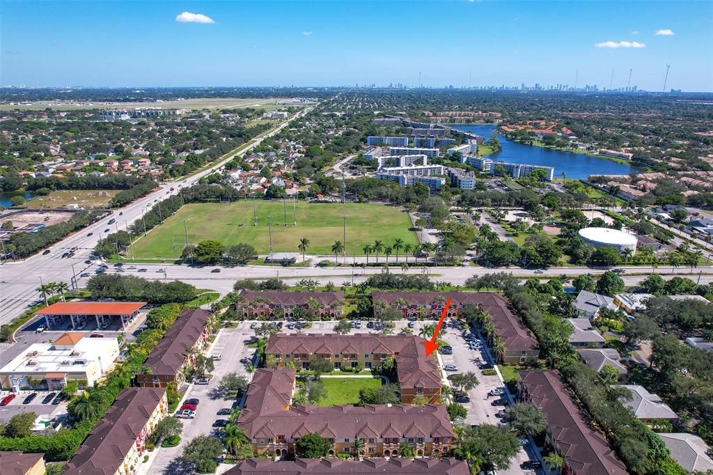 8915 Southwest 19th Street, Unit 8915 Miramar, FL 33025 - Photo 23 of 27 an aerial view of a city with lots of residential buildings ocean and mountain view in back