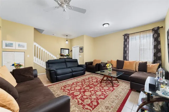 a living room with furniture and a rug