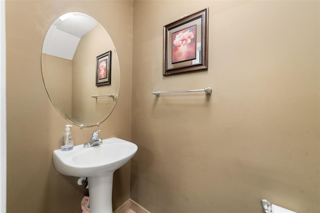 8915 Southwest 19th Street, Unit 8915 Miramar, FL 33025 - Photo 5 of 27 a bathroom with a sink mirror and toilet