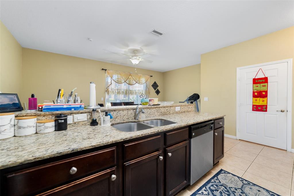 8915 Southwest 19th Street, Unit 8915 Miramar, FL 33025 - Photo 8 of 27 a kitchen with lots of counter space and sink