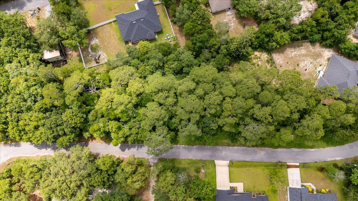 3113 Evans Avenue Navarre, FL 32566 - Photo 3 of 8 an aerial view of a house with a yard