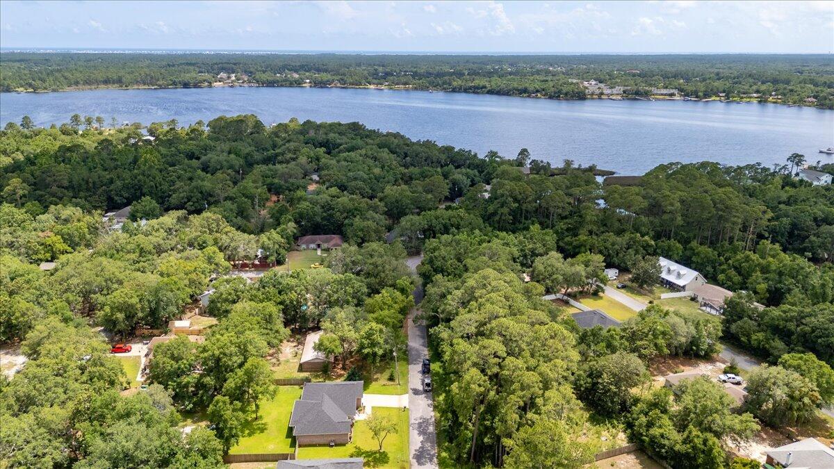 3113 Evans Avenue Navarre, FL 32566 - Photo 8 of 8 an aerial view of a houses with a lake view