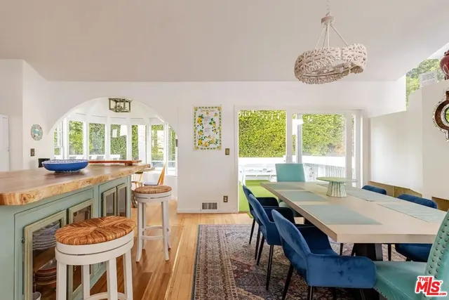 a view of a dining room with furniture window and outside view