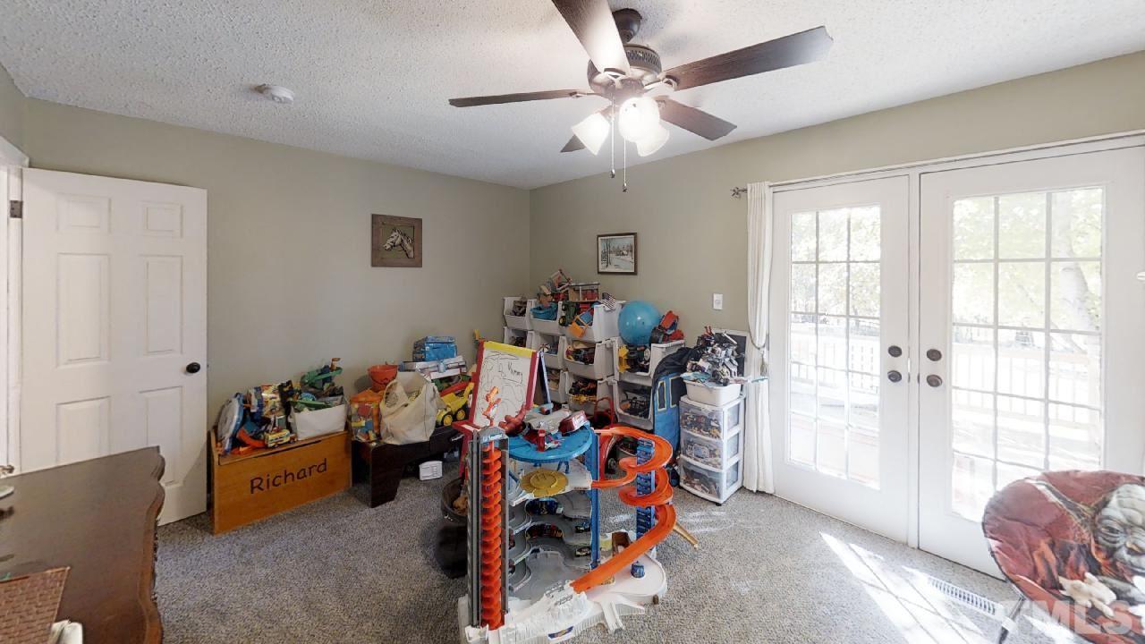 10027 Rougemont Road Bahama, NC 27503 - Photo 8 of 25 a view of a room with gym equipment