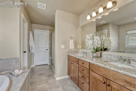 a large kitchen with stainless steel appliances granite countertop a sink and a stove