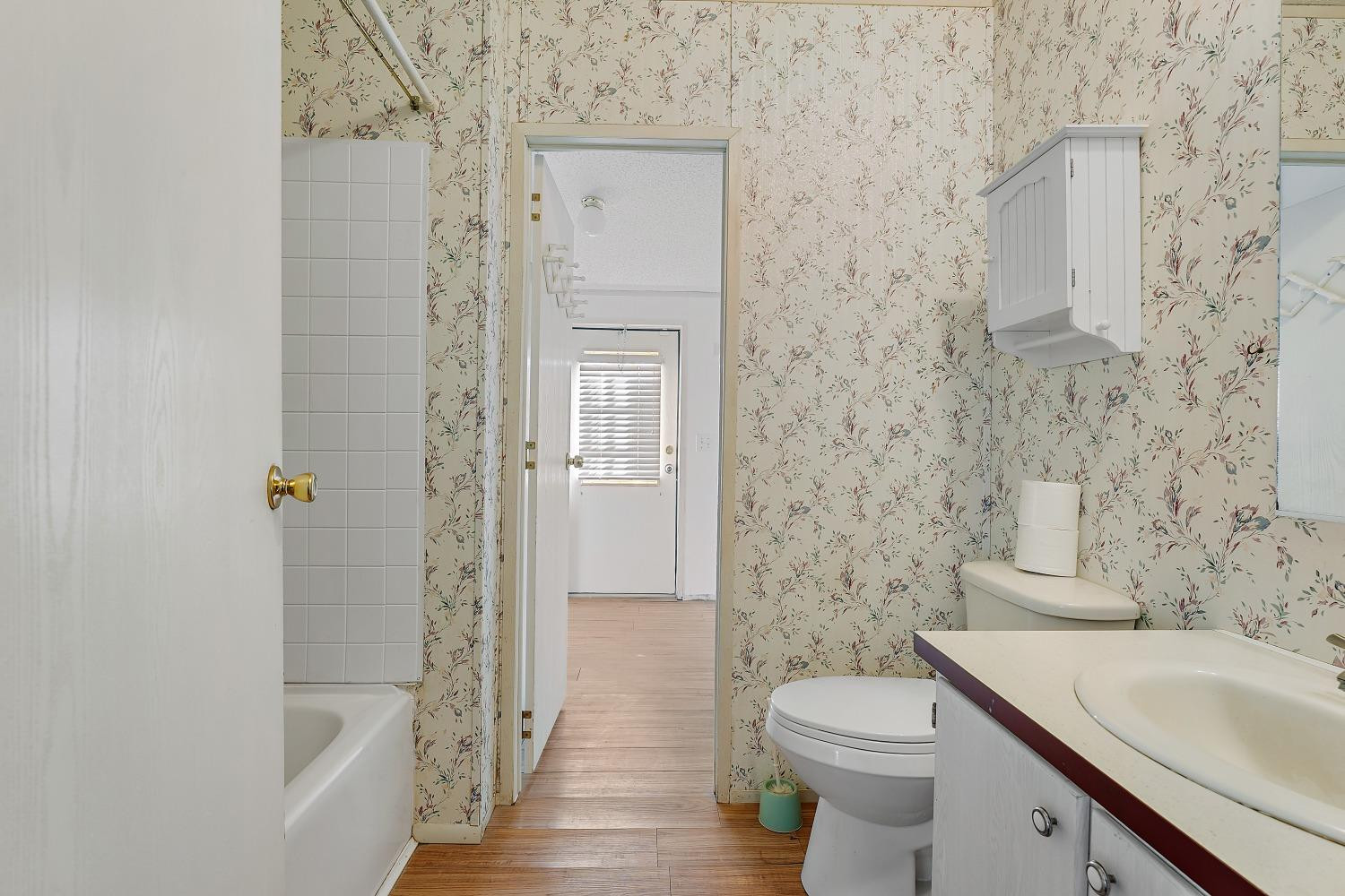 5501 County Road 1240 Lubbock, TX 79407 - Photo 17 of 22 a bathroom with a sink a toilet and shower