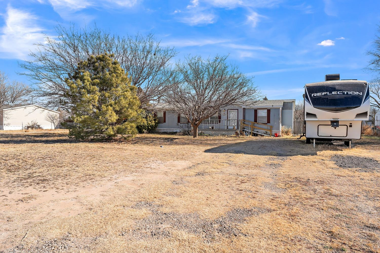 5501 County Road 1240 Lubbock, TX 79407 - Photo 2 of 22 a view of road with large trees