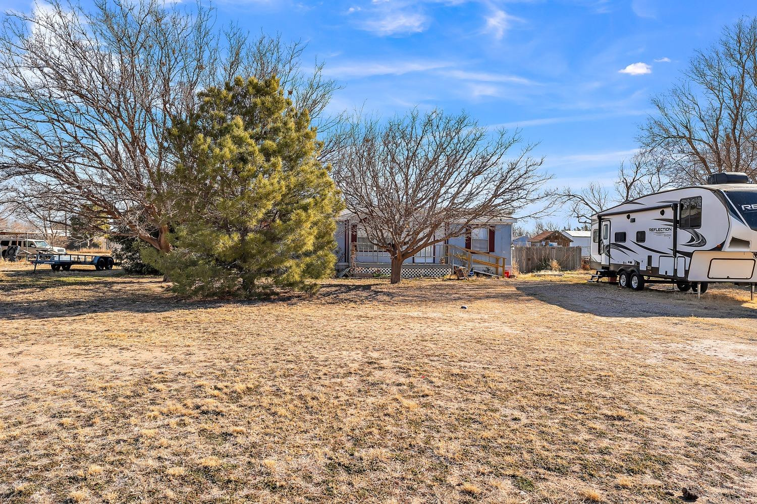 5501 County Road 1240 Lubbock, TX 79407 - Photo 3 of 22 a street view covered with snow