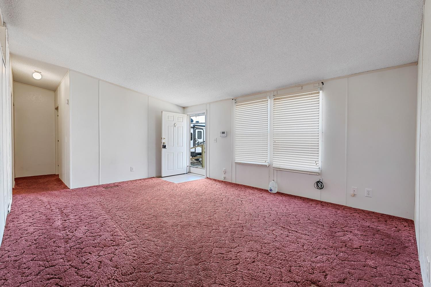 5501 County Road 1240 Lubbock, TX 79407 - Photo 5 of 22 a view of an empty room with a window