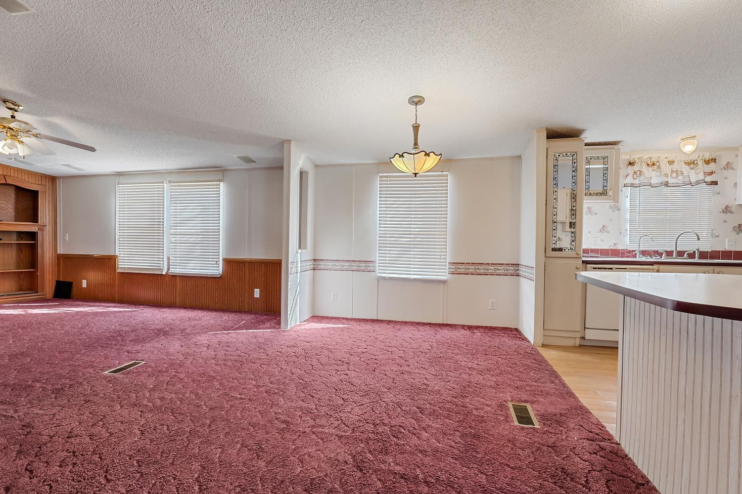 5501 County Road 1240 Lubbock, TX 79407 - Photo 8 of 22 a view of a kitchen with kitchen island stainless steel appliances wooden floor and window