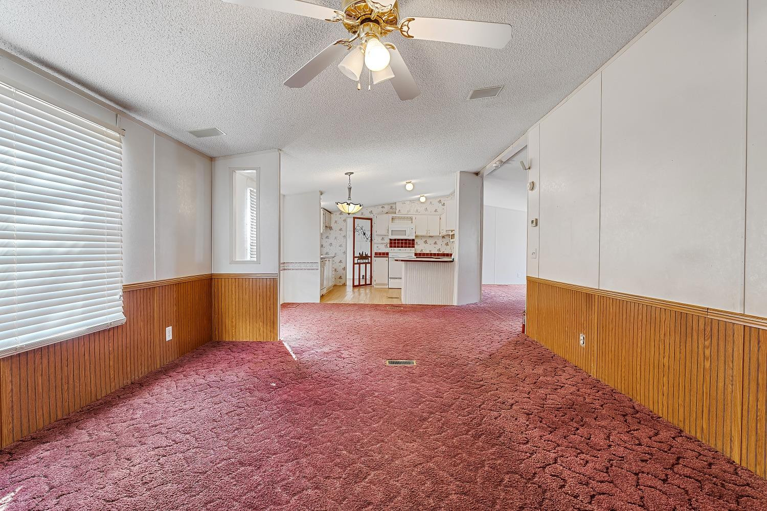 5501 County Road 1240 Lubbock, TX 79407 - Photo 10 of 22 a living room with furniture and a chandelier