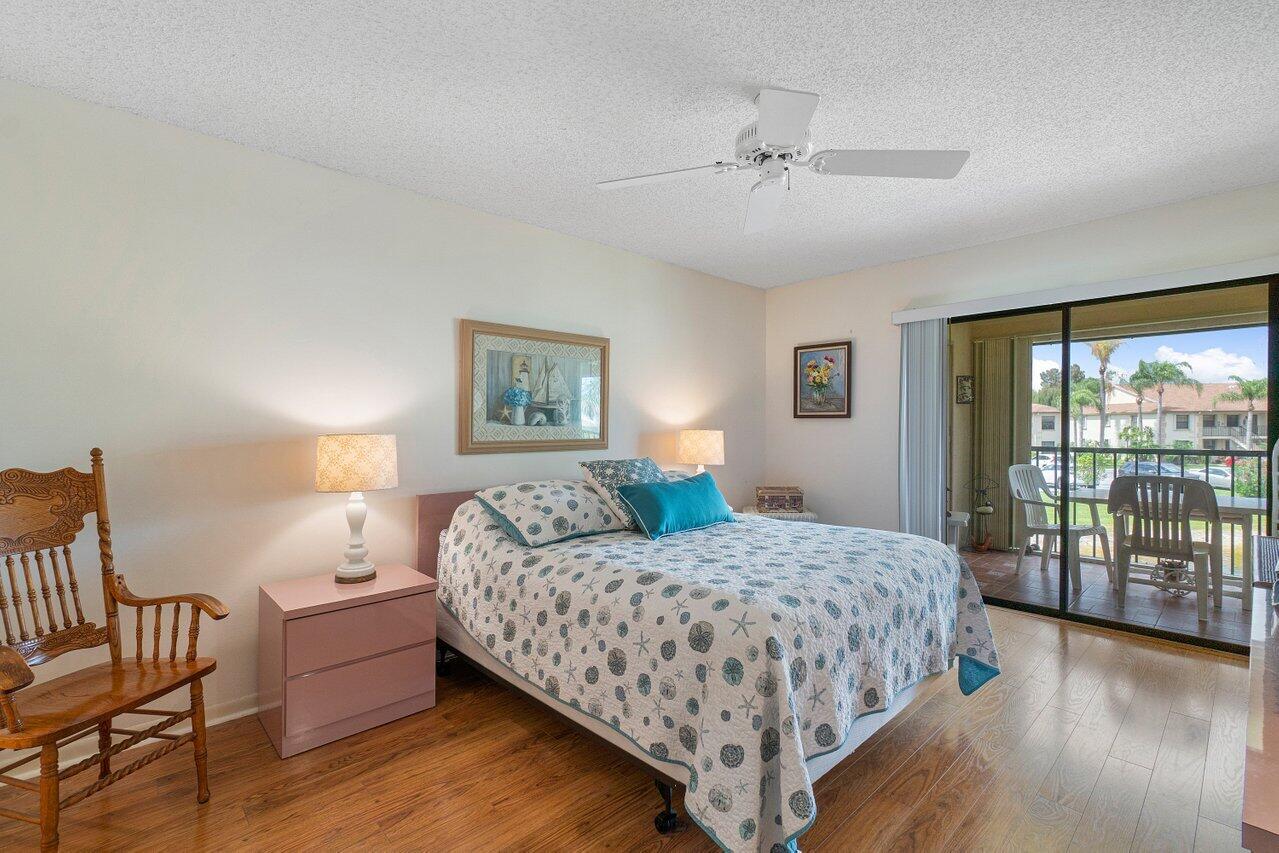 1402 Pinecrest Circle, Unit C Jupiter, FL 33458 - Photo 12 of 27 Master Bedroom
