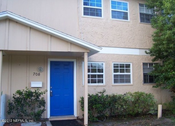 708 Cavalla Road Atlantic Beach, FL 32233 - Photo 1 of 4 a view of a building with a yard