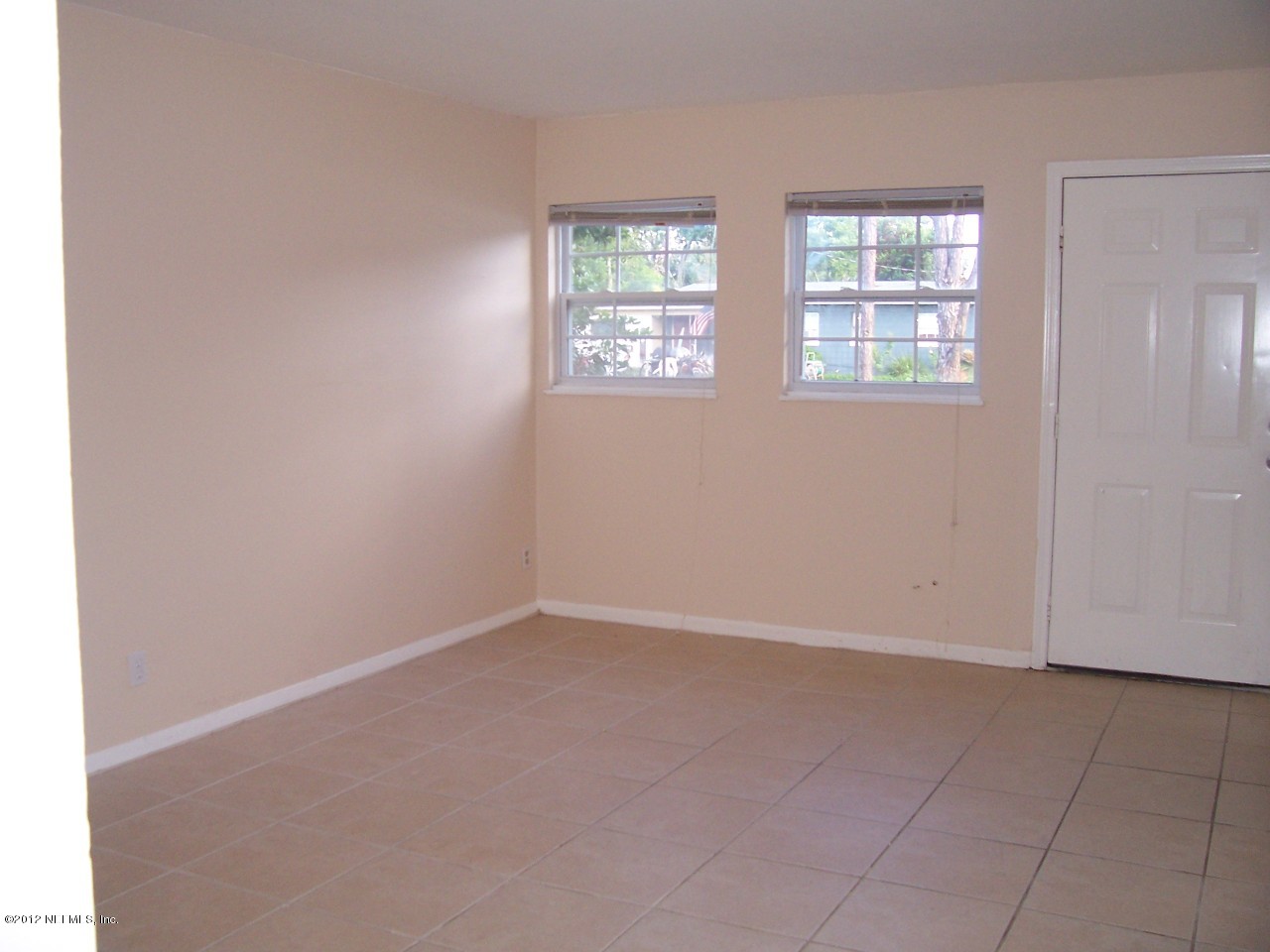 708 Cavalla Road Atlantic Beach, FL 32233 - Photo 4 of 4 an empty room with windows