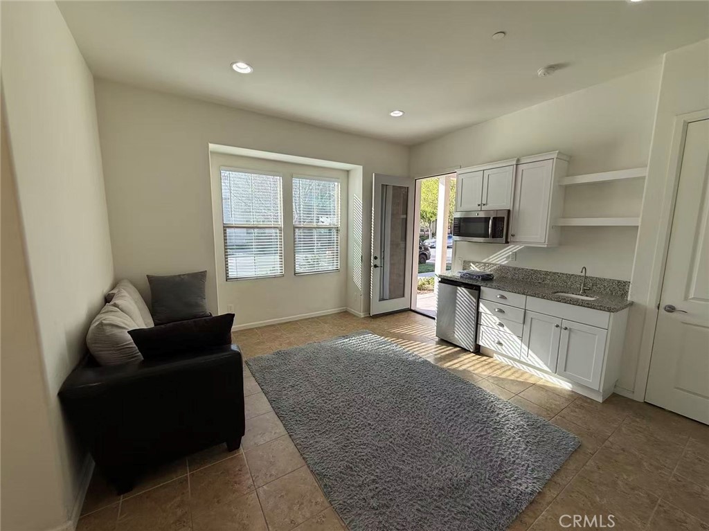 130 Follyhatch Irvine, CA 92618 - Photo 3 of 8 a living room with furniture and a window