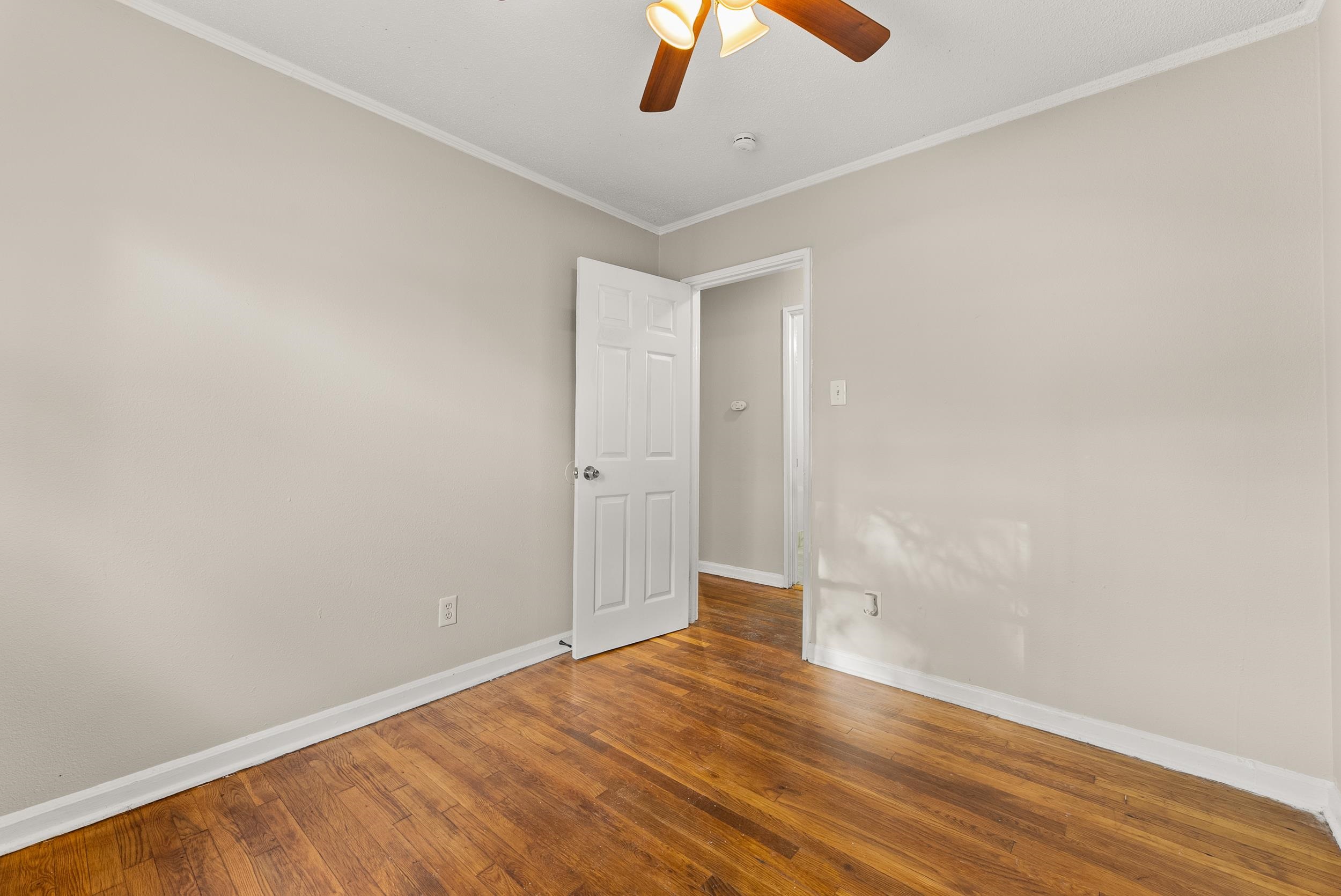 686 Delta Road Memphis, TN 38109 - Photo 14 of 24 a view of an empty room with wooden floor