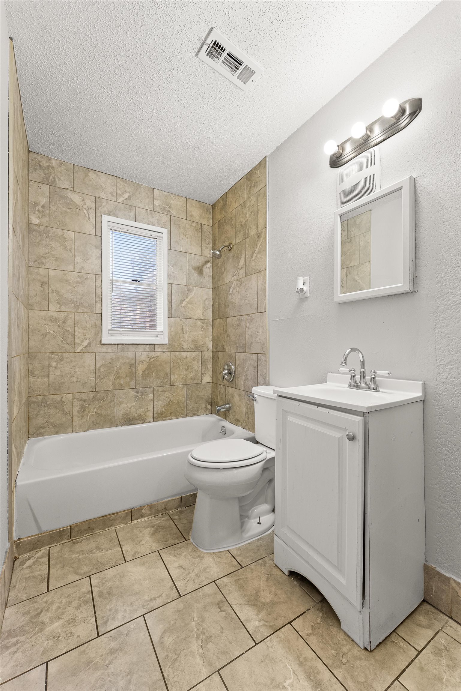 686 Delta Road Memphis, TN 38109 - Photo 15 of 24 a bathroom with a sink a toilet and shower