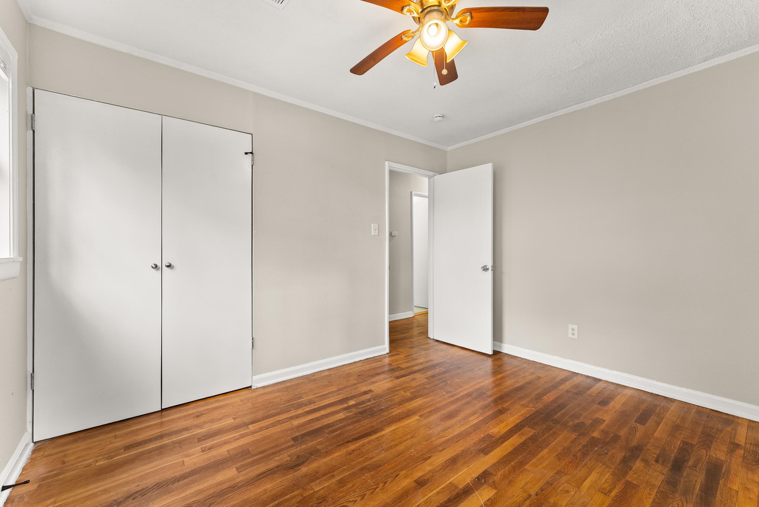 686 Delta Road Memphis, TN 38109 - Photo 18 of 24 a view of an empty room with wooden floor