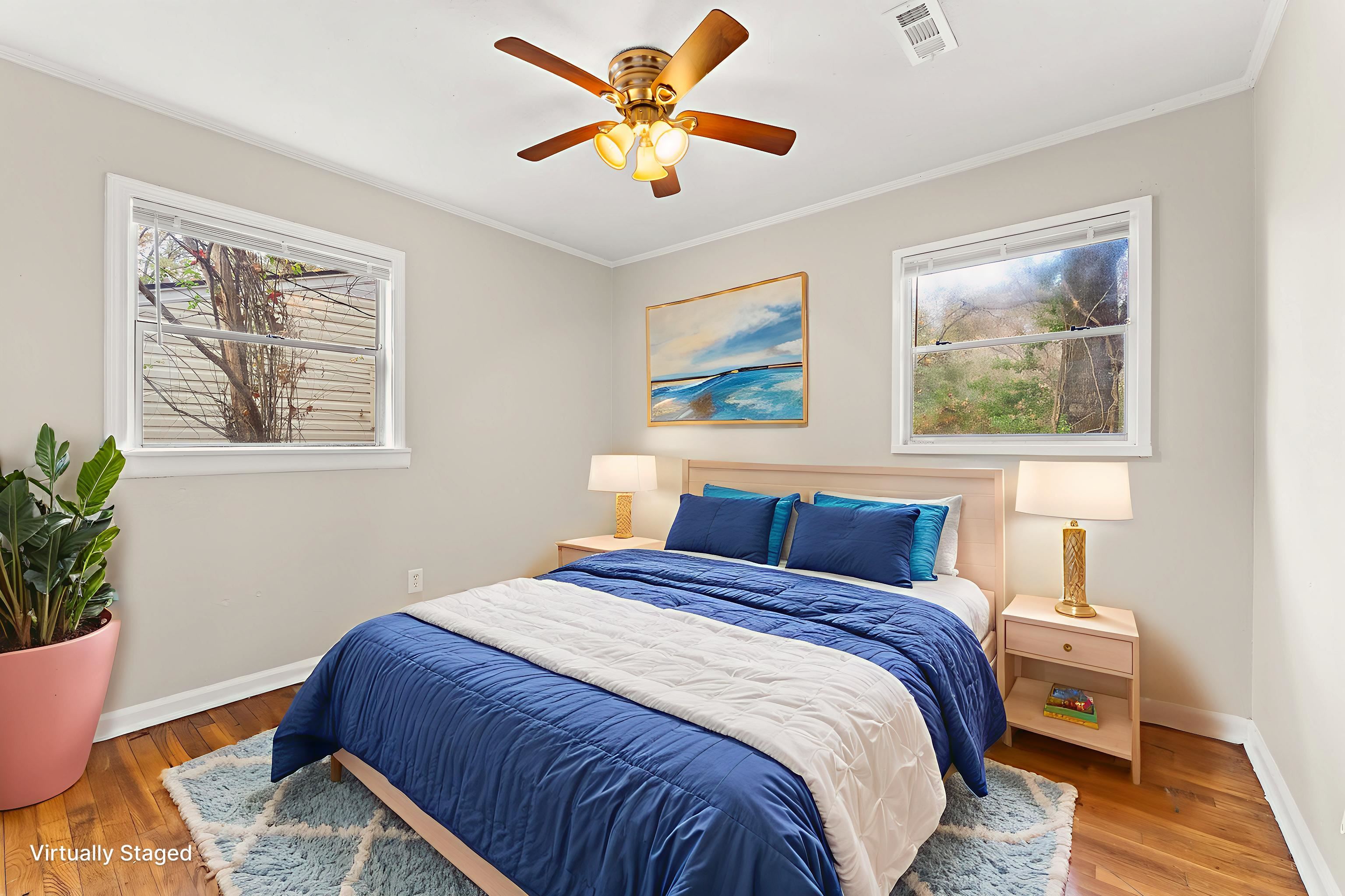 686 Delta Road Memphis, TN 38109 - Photo 19 of 24 a bedroom with a bed and a painting on the wall