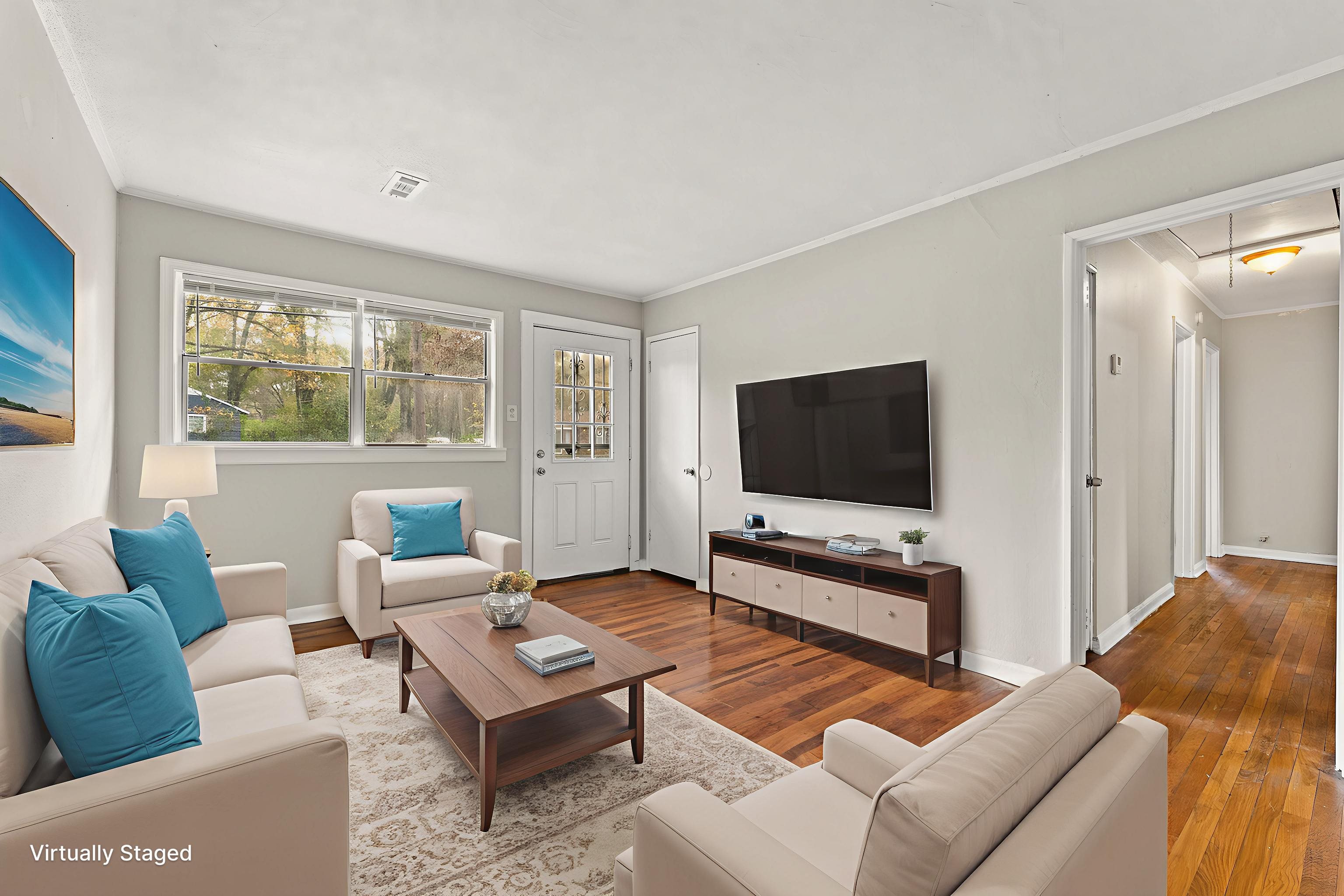 686 Delta Road Memphis, TN 38109 - Photo 2 of 24 a living room with furniture and a flat screen tv