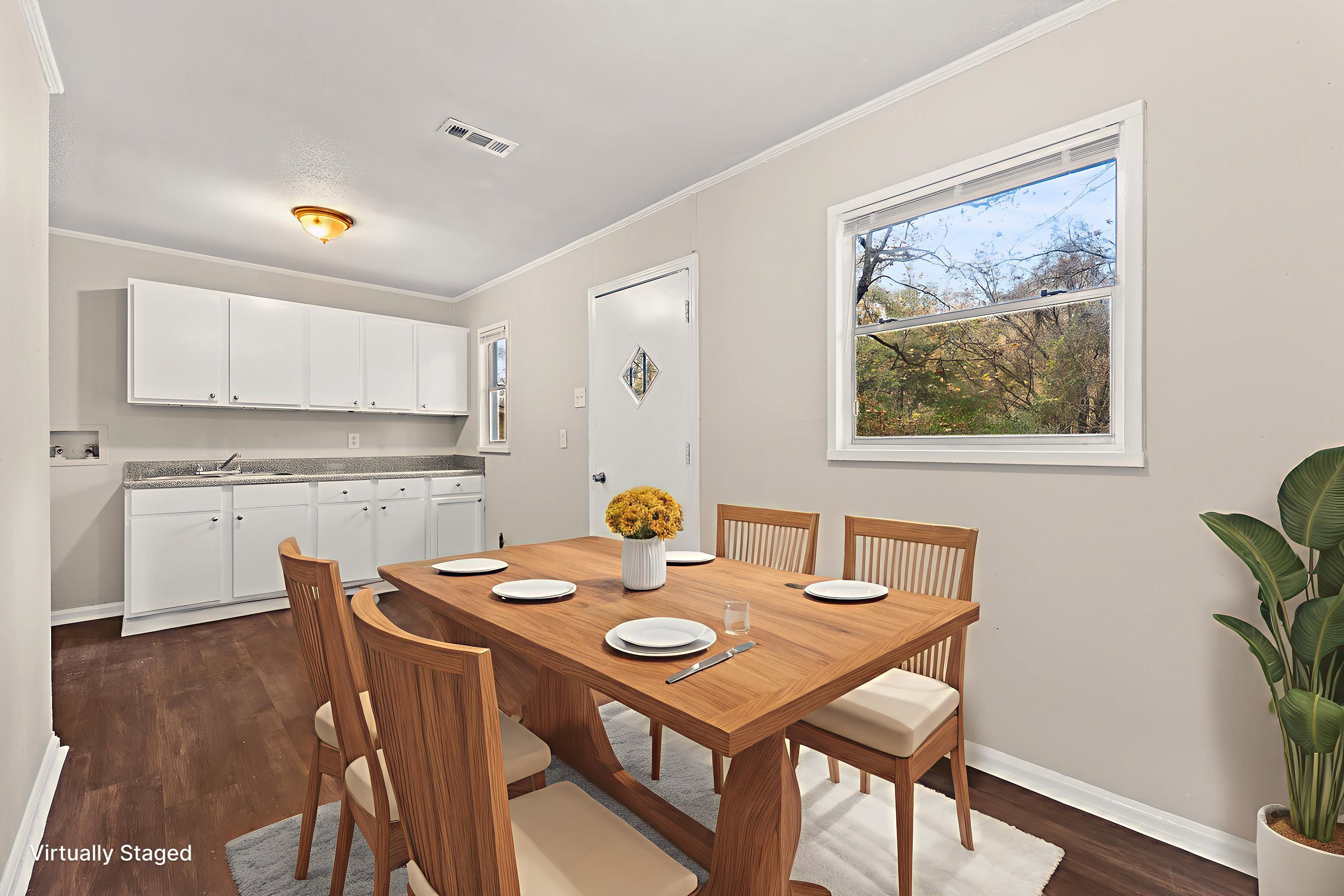 686 Delta Road Memphis, TN 38109 - Photo 5 of 24 a view of a dining room with furniture and wooden floor