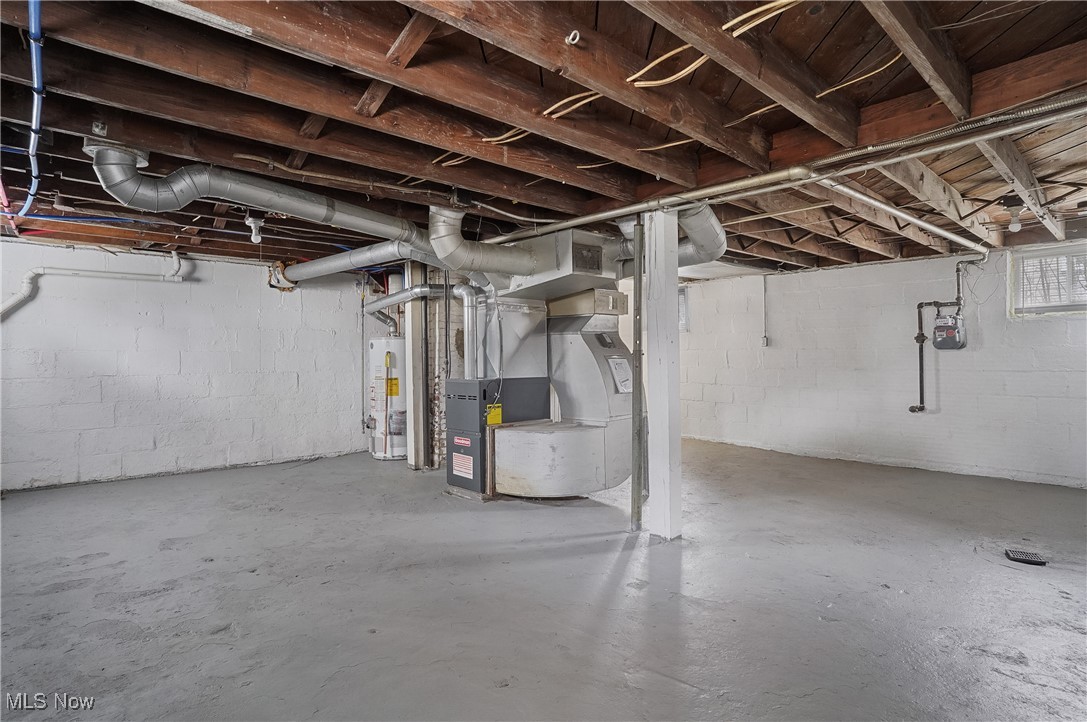 646 Brittain Road Akron, OH 44305 - Photo 30 of 36 Below grade area featuring gas water heater and heating unit