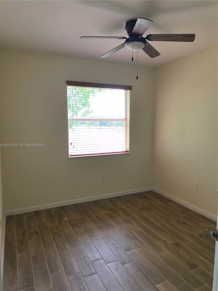 1645 Southeast 20th Road, Unit 1645 Homestead, FL 33035 - Photo 14 of 20 a view of a room that has a window in it