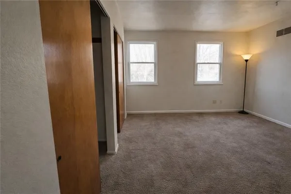 an empty room with windows