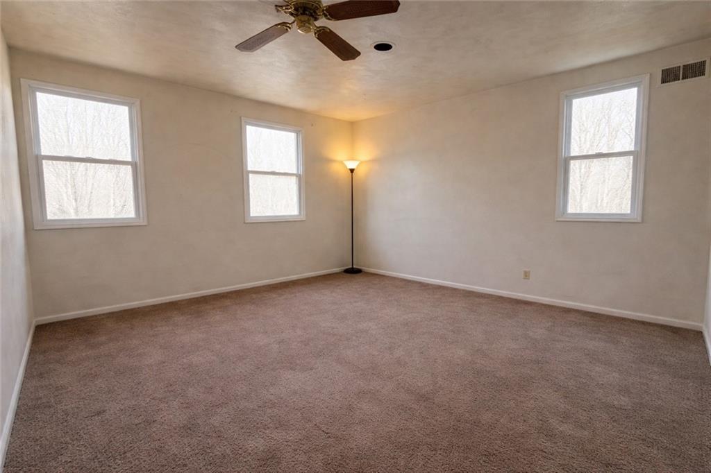 1515 Manhattan Street Pittsburgh, PA 15233 - Photo 16 of 46 an empty room with windows and fan