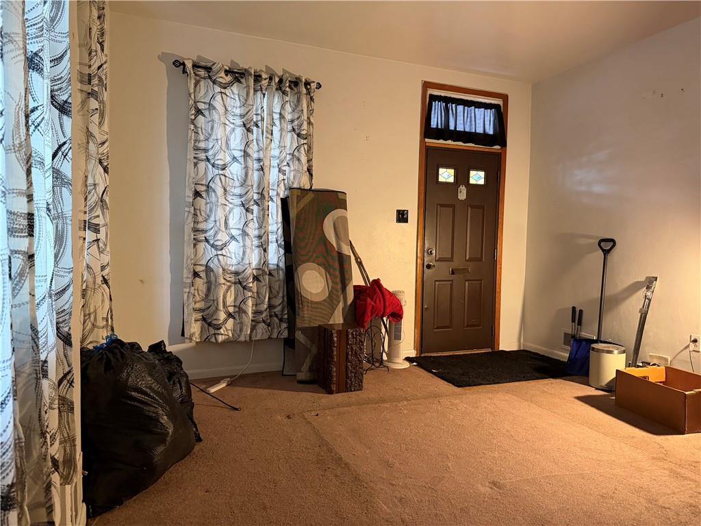 1515 Manhattan Street Pittsburgh, PA 15233 - Photo 19 of 46 a bedroom with double bed and a closet