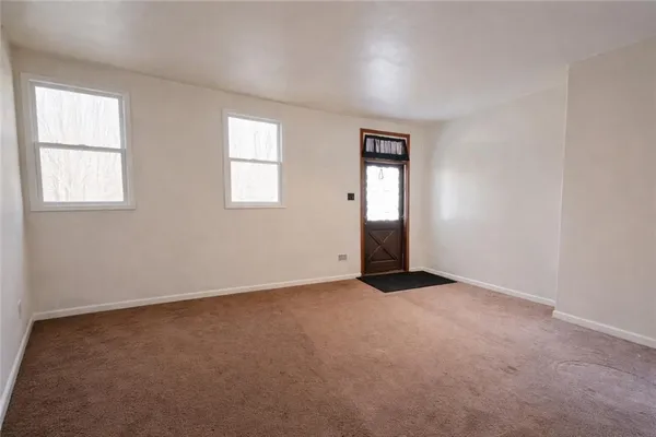 an empty room with windows
