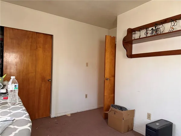 a view of staircase with rug