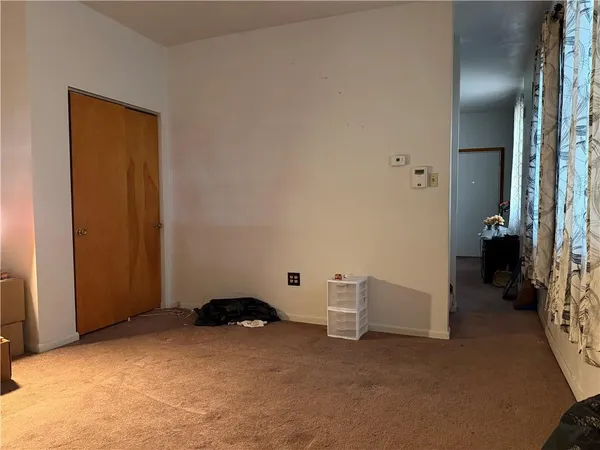a big room with closet and a bathroom