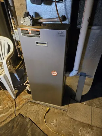 a view of a brick house with large windows and a table and chairs