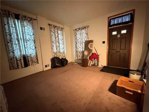 a room with gym equipment and a large window