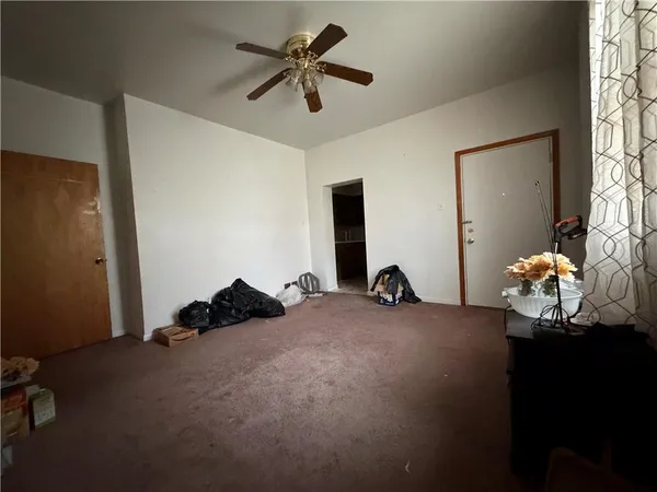 a bed room with a bed and a chandelier