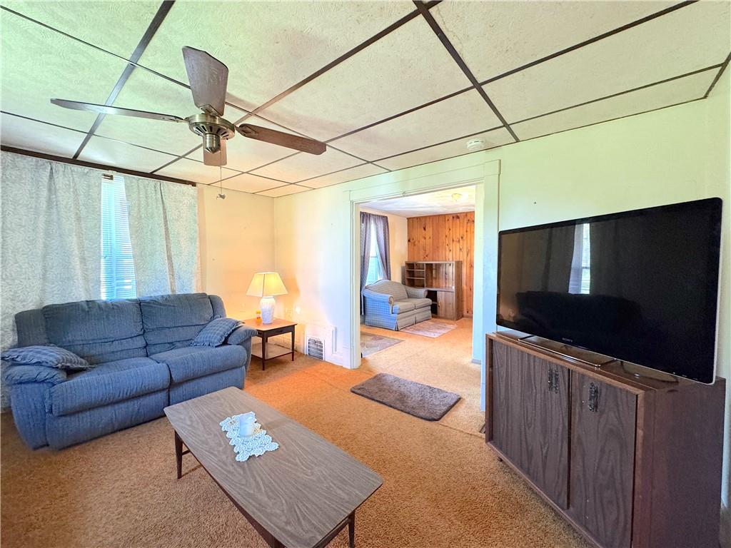 3003 Riverside Drive Claridge, PA 15623 - Photo 14 of 28 a living room with furniture and a flat screen tv