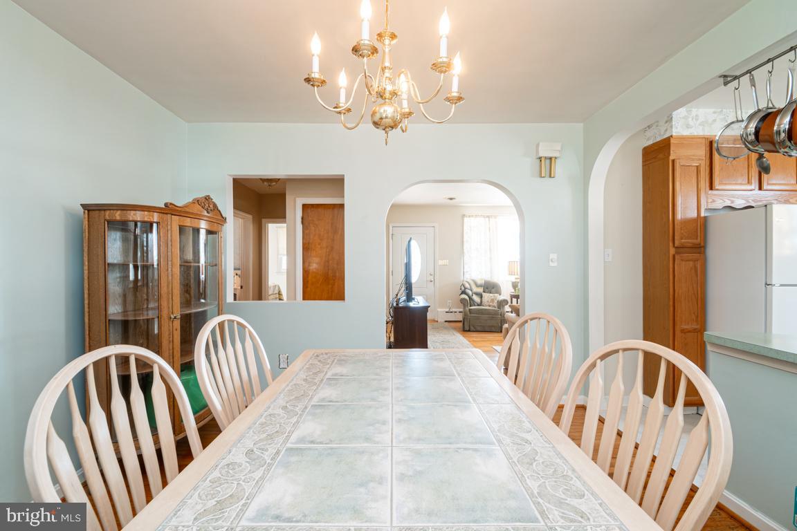 8504 Bassett Road Baltimore, MD 21237 - Photo 11 of 35 a view of a balcony with furniture and chandelier