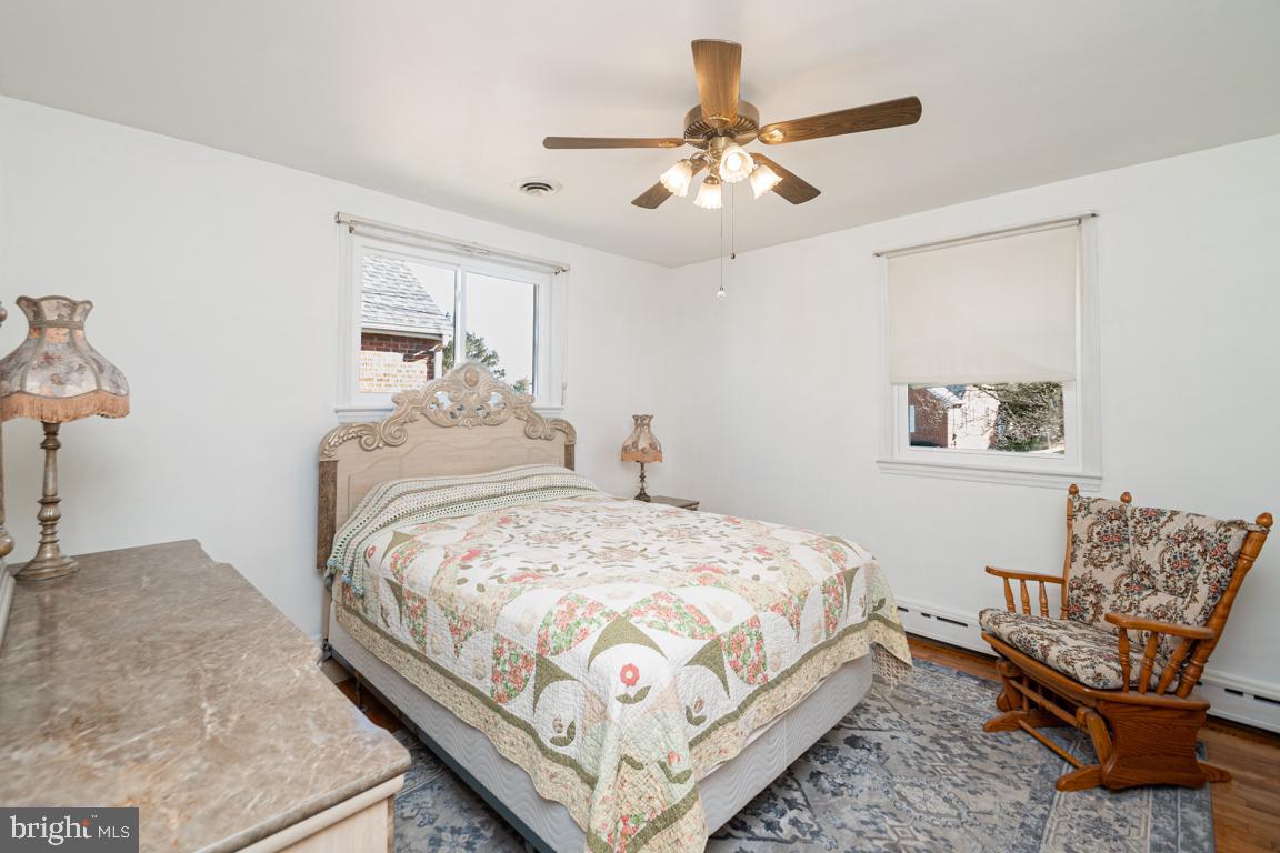 8504 Bassett Road Baltimore, MD 21237 - Photo 20 of 35 a bedroom with a bed and ceiling fan