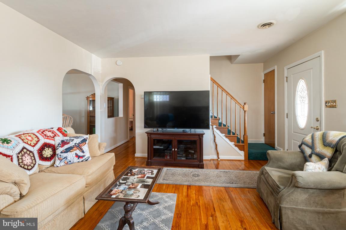 8504 Bassett Road Baltimore, MD 21237 - Photo 2 of 35 a living room with furniture and a flat screen tv