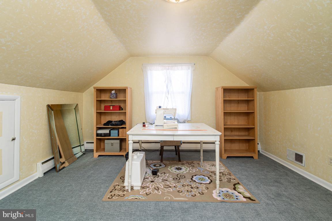 8504 Bassett Road Baltimore, MD 21237 - Photo 23 of 35 a living room with furniture a window and a table