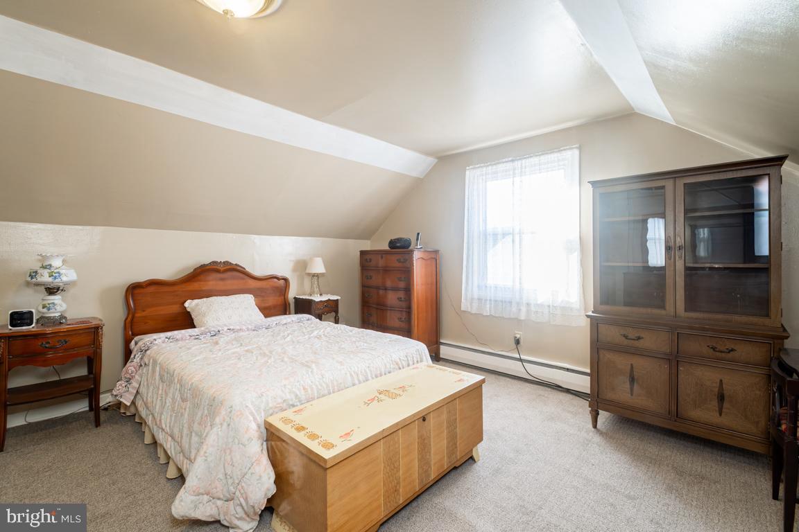 8504 Bassett Road Baltimore, MD 21237 - Photo 25 of 35 a bedroom with a bed and a dresser