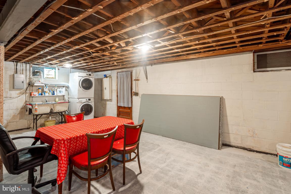 8504 Bassett Road Baltimore, MD 21237 - Photo 30 of 35 a dining room with a wooden table and chairs