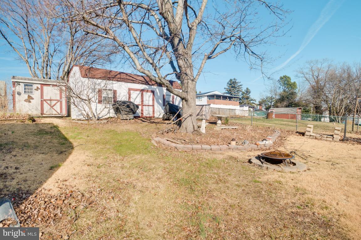 8504 Bassett Road Baltimore, MD 21237 - Photo 33 of 35 a backyard of a house with a table and chairs and couches