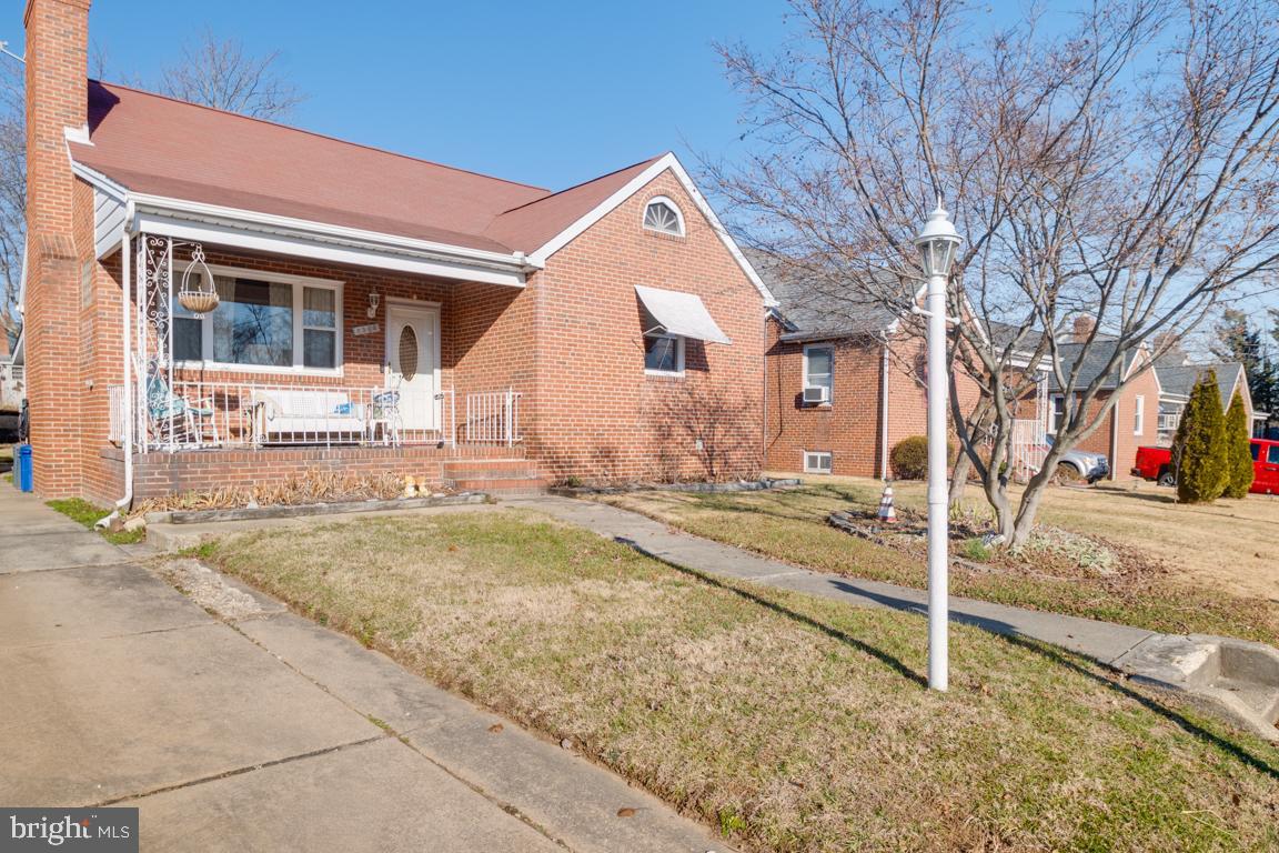 8504 Bassett Road Baltimore, MD 21237 - Photo 4 of 35 a view of a house with snow on the road