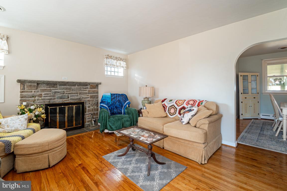 8504 Bassett Road Baltimore, MD 21237 - Photo 6 of 35 a living room with furniture and a fireplace